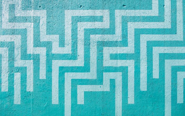 Abstract turquoise maze pattern symbolizing clarity emerging from confusion.